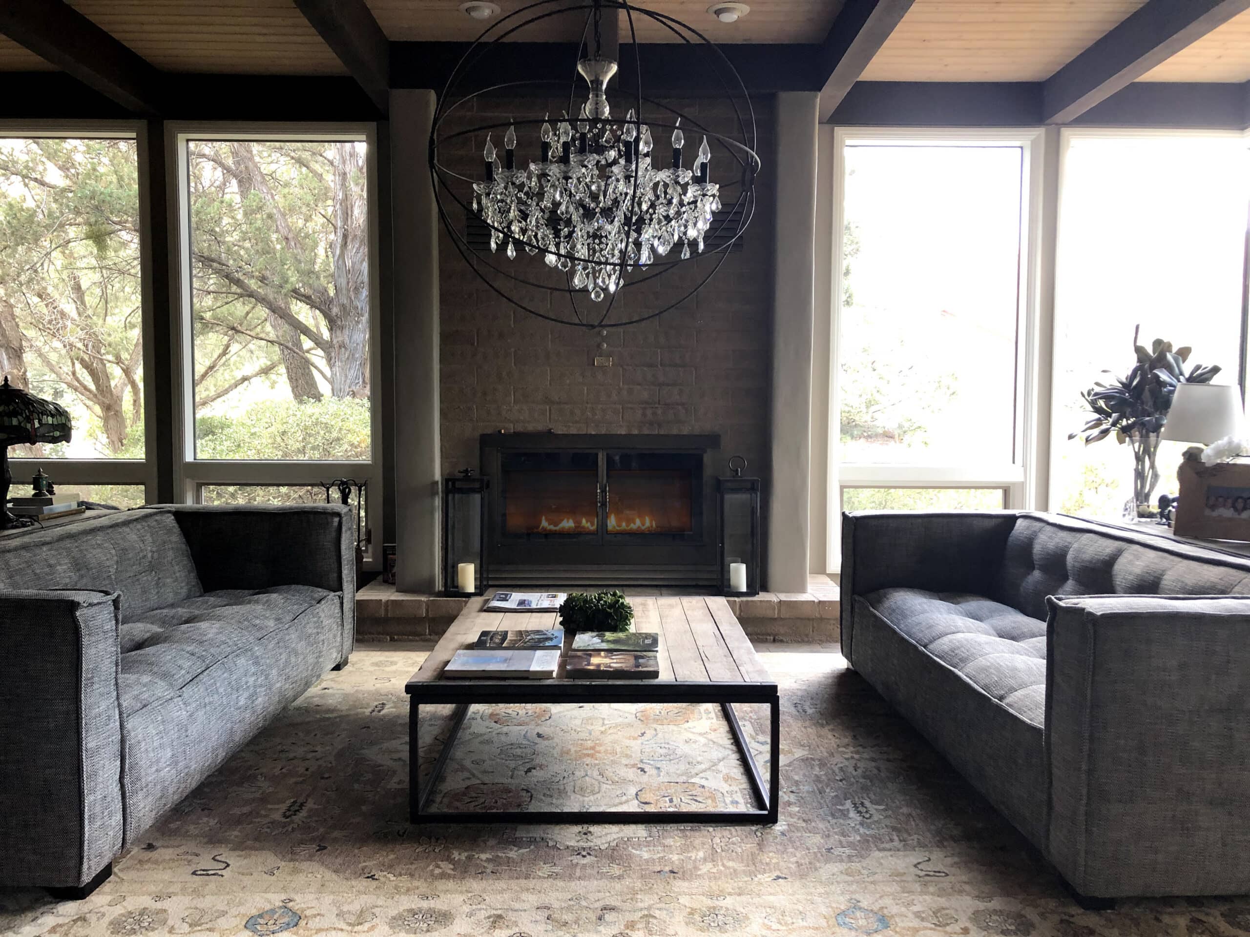 Full-Service Interior Design 1 modern desert sedona style living area with fireplace and chandelier