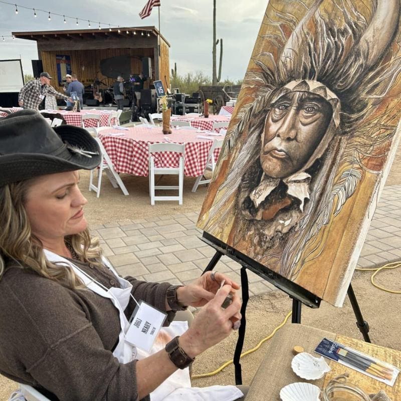 Award-winning artist Julie "Jooj" Neary painting with Sedona dirt, a collaboration with Sedona Interior Designer Dana Cavanaugh highlighting biophilic design and local materials.